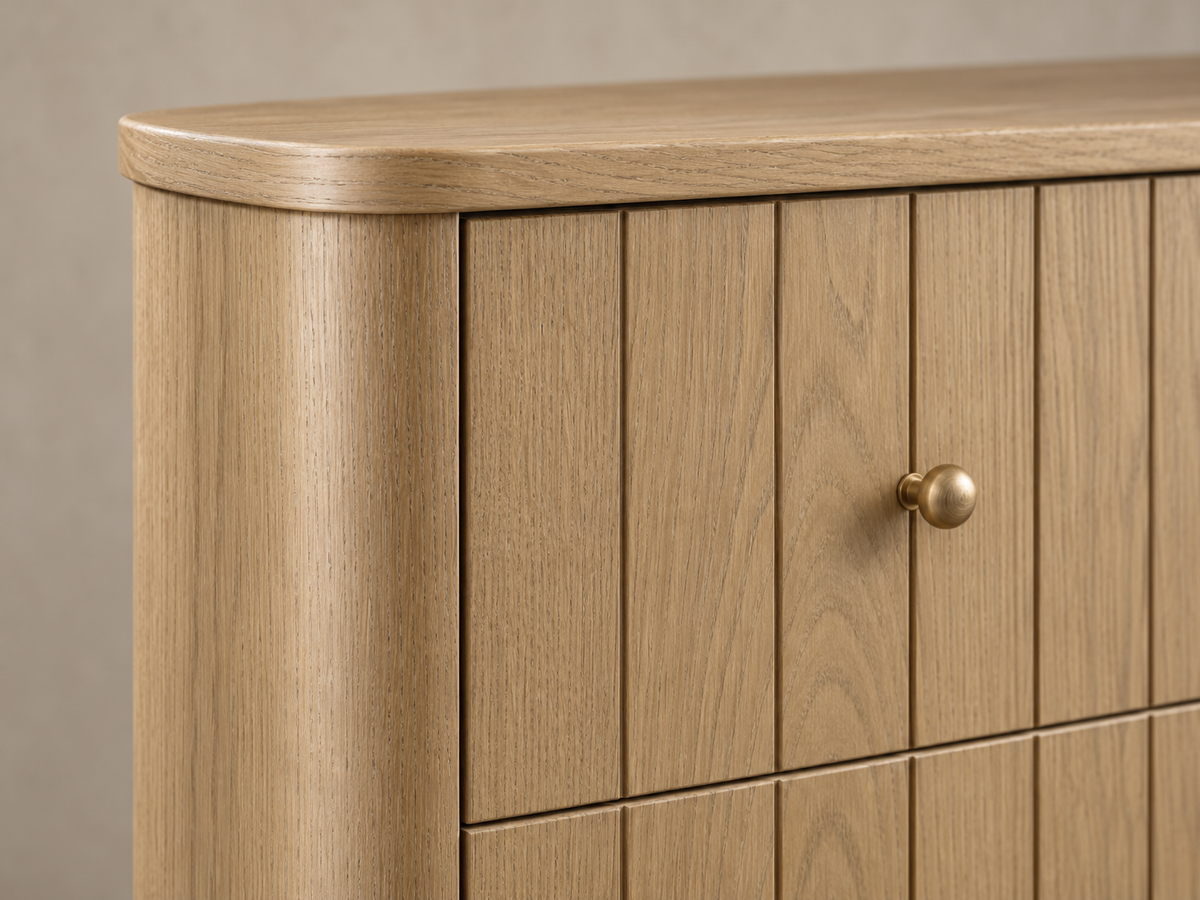 Houston 50-inch dresser in Nordic White Oak — rendered close-up of the rounded corner, brass-tone knob and oak grain.