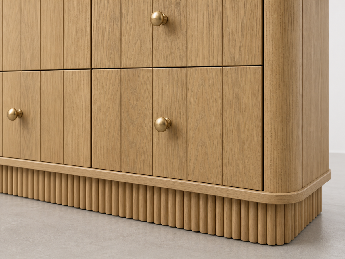 Detail rendering of Houston 72-inch Dresser in Nordic White Oak showing oak grain, brass knob, rounded corner and reeded base