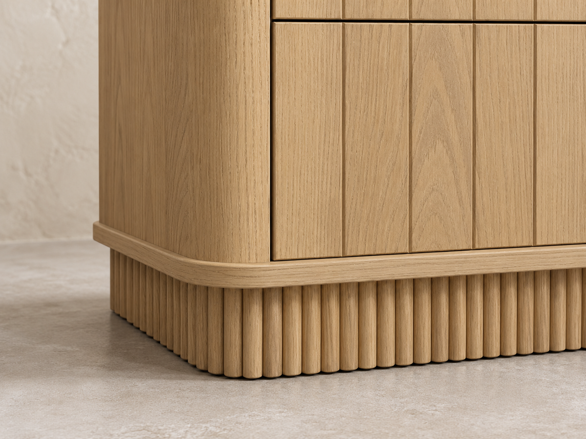 Houston 72-inch dresser in Nordic White Oak — rendered detail of the rounded corner and reeded plinth on a limewash background.