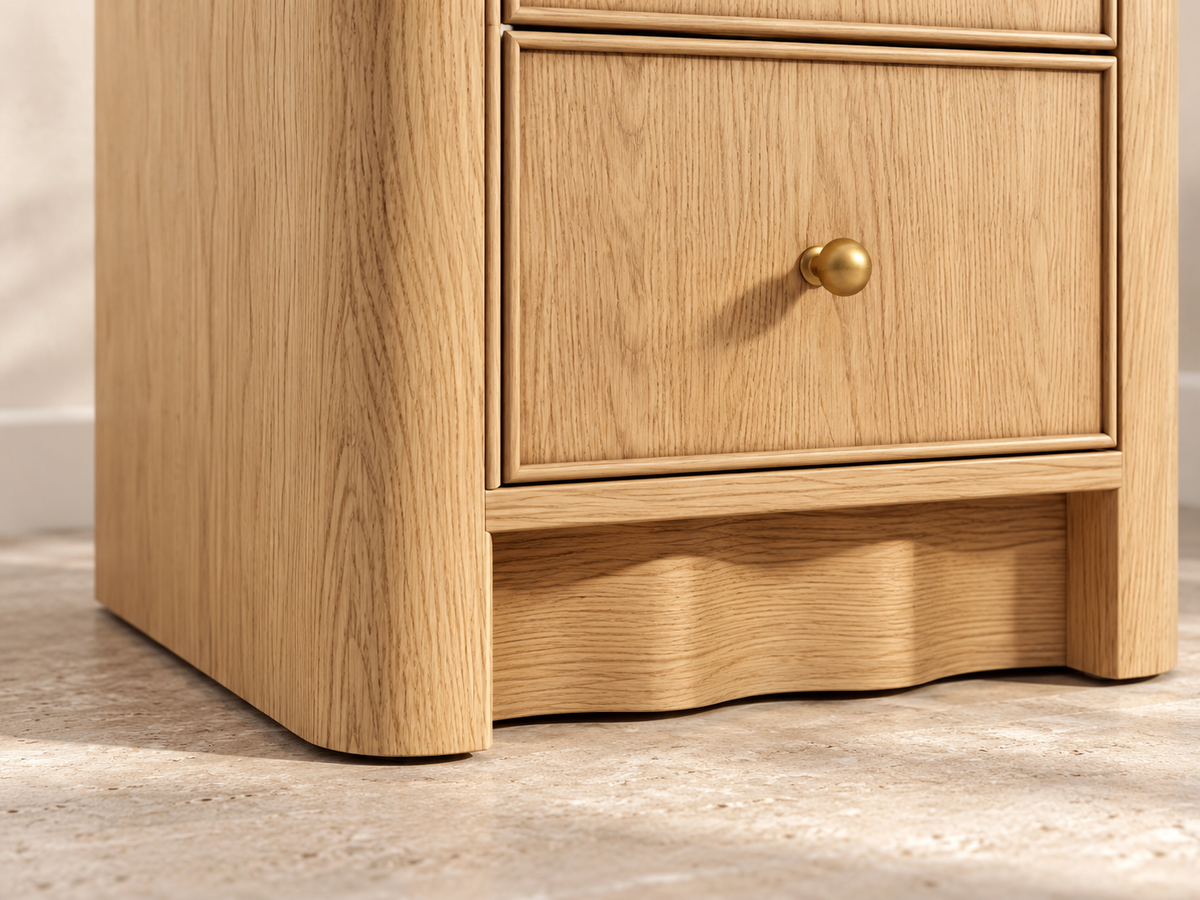 Orlando Nordic White Oak 20-inch two-drawer nightstand. Detail of the sculpted wave base and rounded corner.