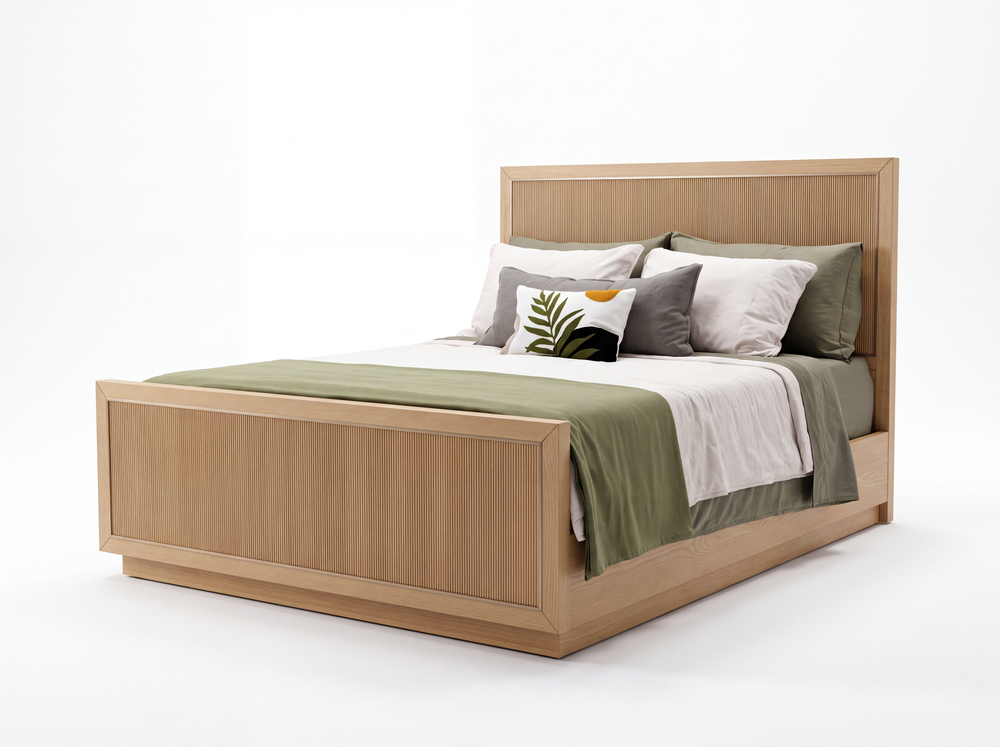 Sonoma bed in Nordic White Oak with reeded panels, green and white bedding, and a closed oak base, shown on a white studio background