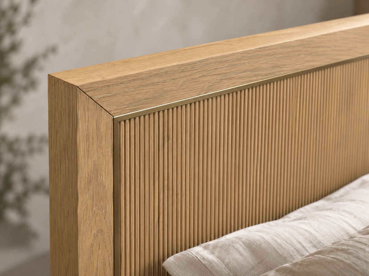Rendered Sonoma bed in Nordic White Oak — headboard miter macro. Bedding and decor shown for styling.