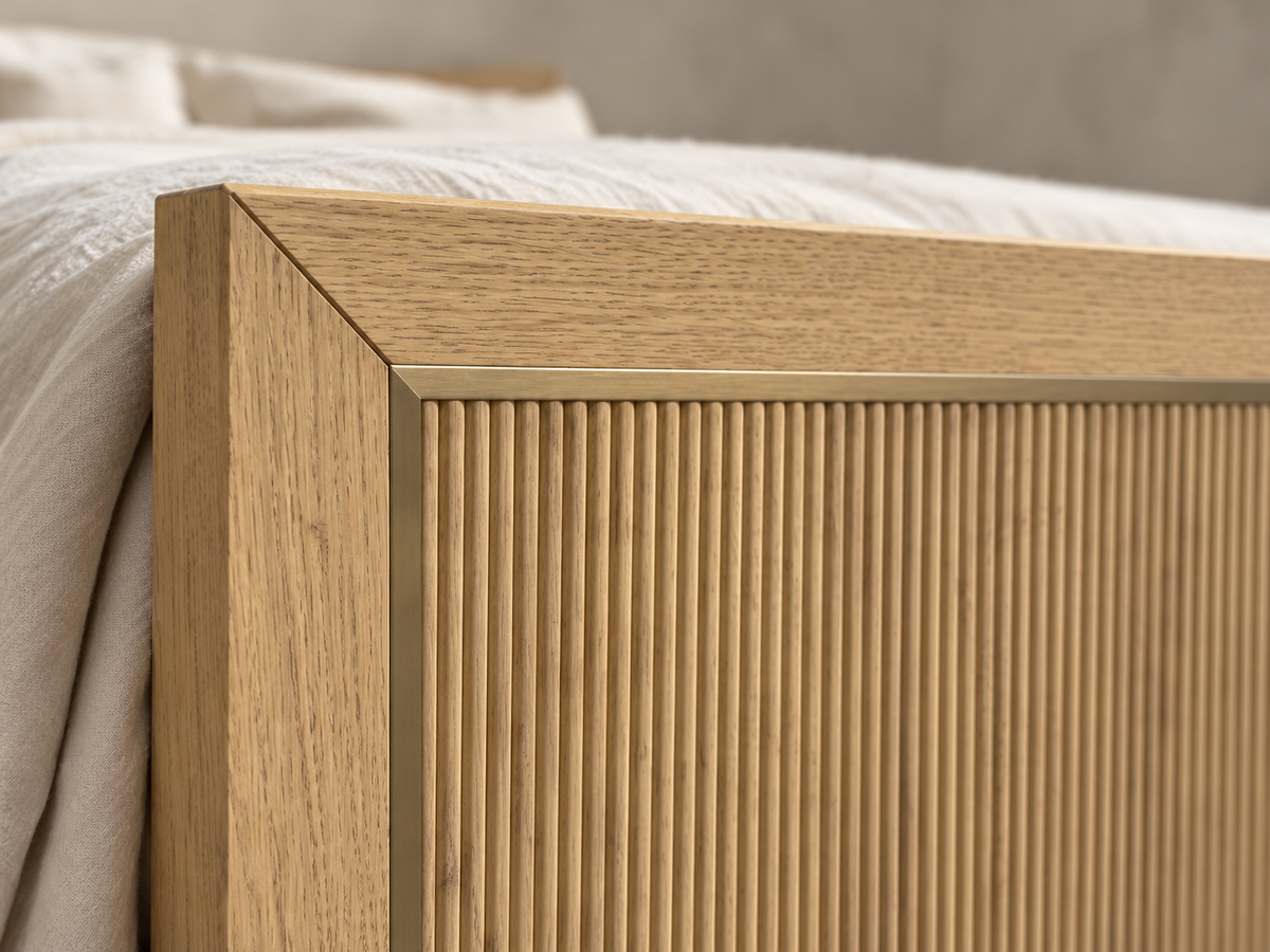 Rendered Sonoma bed in Nordic White Oak — footboard reeding macro. Bedding and decor shown for styling.