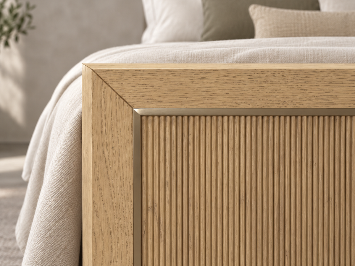 Rendered Sonoma bed in Nordic White Oak — footboard corner detail. Bedding and decor shown for styling.