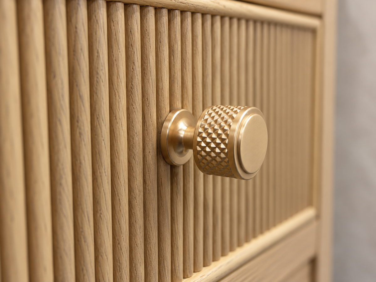 Rendered Sonoma 50-inch dresser in Nordic White Oak — hardware macro. Room decor shown for styling.