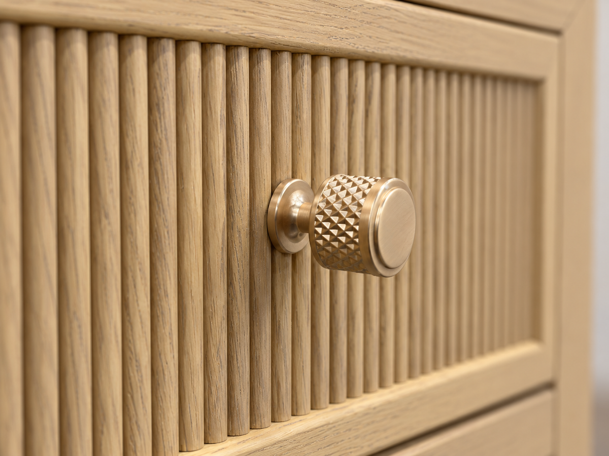 Rendered Sonoma 20-inch nightstand in Nordic White Oak — hardware macro. Room decor is styling.